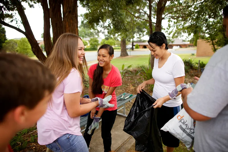 Service project cleaning up outside